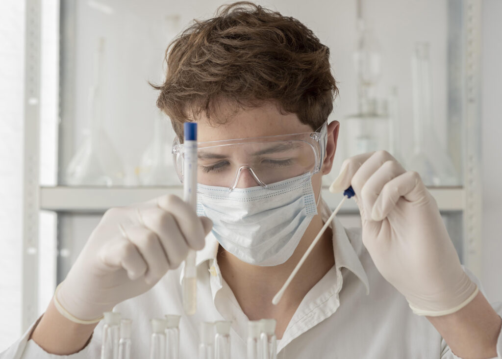 close-up-researcher-looking-flask