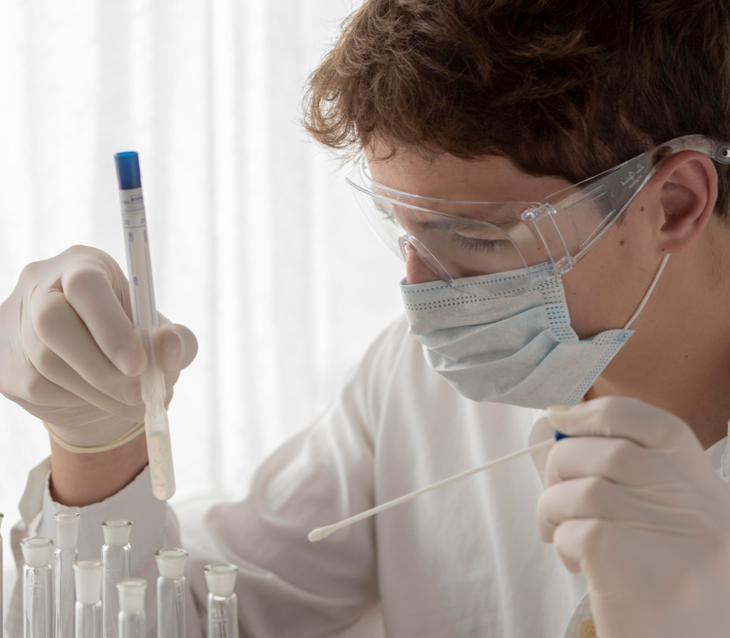 close-up-scientist-looking-flask